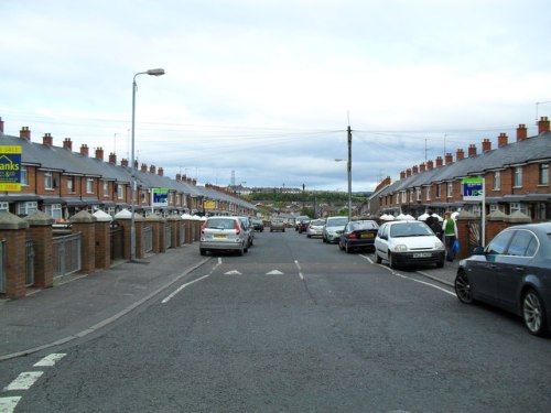 The contemporary view of Ardoyne is cleaner and has more nice cars, but the long blocks of terrace houses look the same.   © Copyright Dean Molyneaux and licensed for reuse under this Creative Commons Licence.